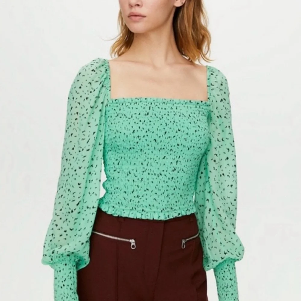 Aritzia green cropped chiffon top.